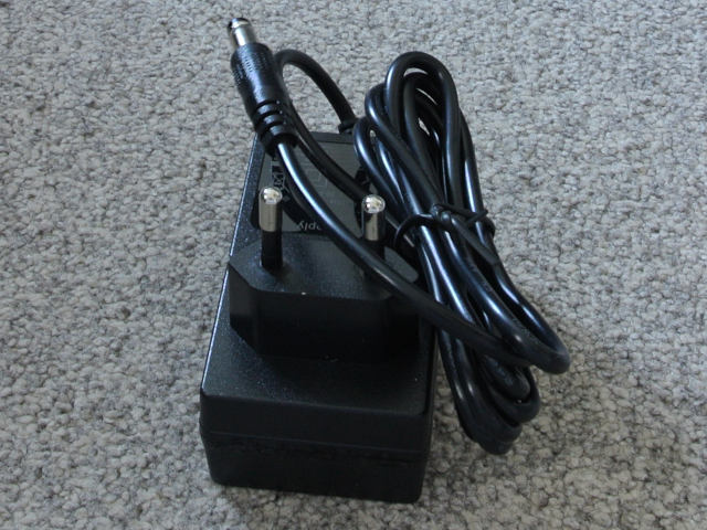 The power supply which is a wall-wart type with a European-style 2 prong plug and a barrel connector at the other end