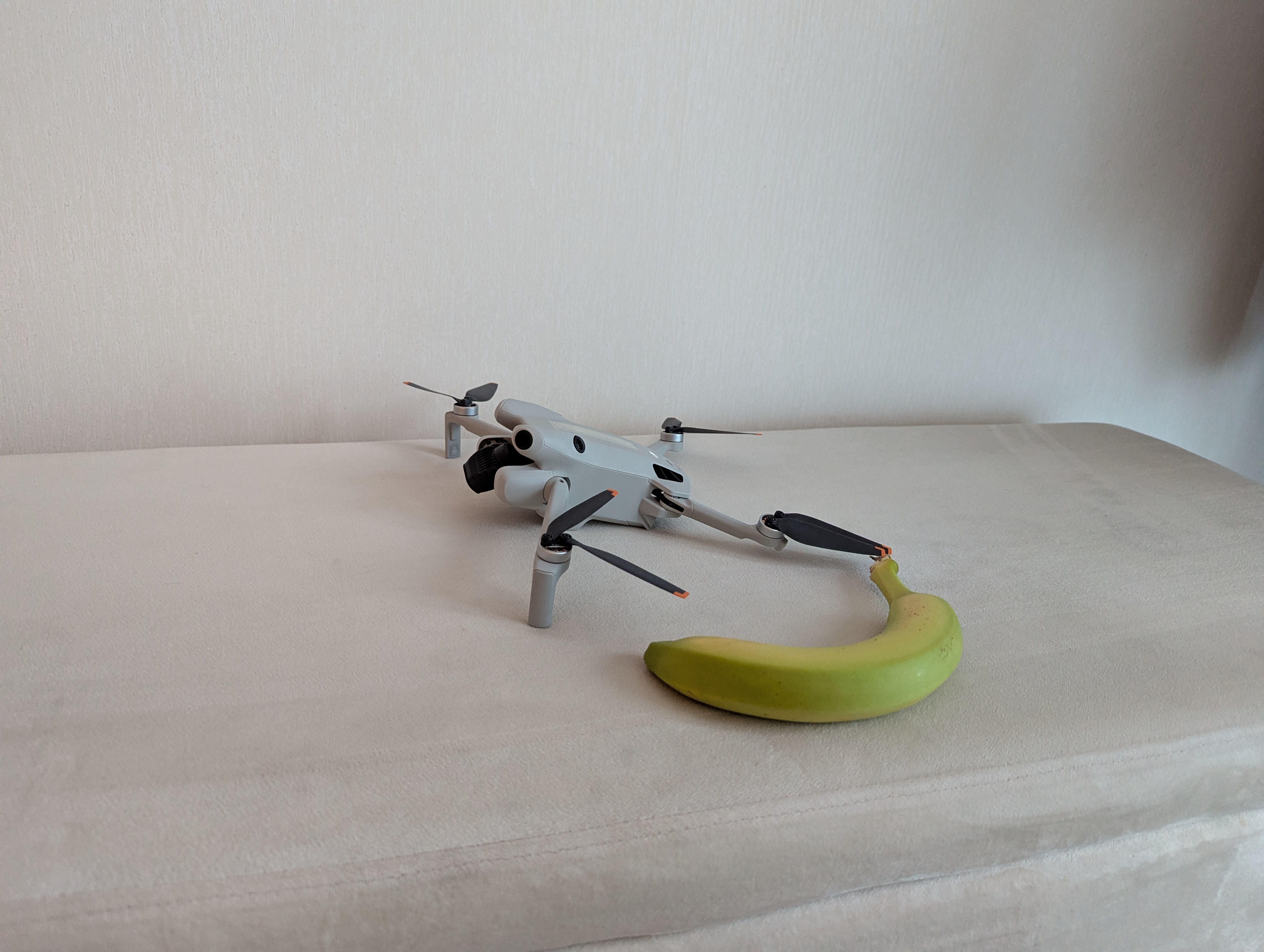 A DJI Mini 4 Pro, with banana for scale