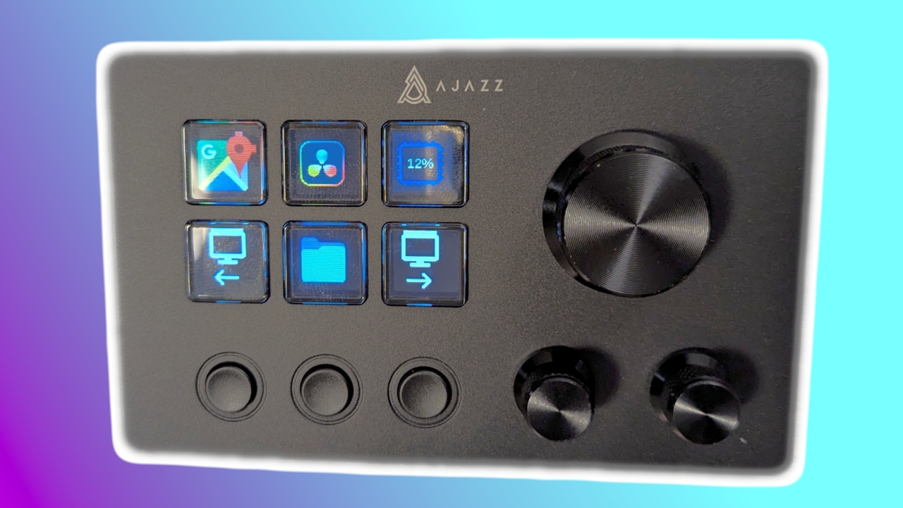 A picture of the AKP03E device, with 2 rows of 3 programmable icon buttons, 3 circular flat buttons below these, a large rotary dial to the right and 2 smaller rotary dials below this